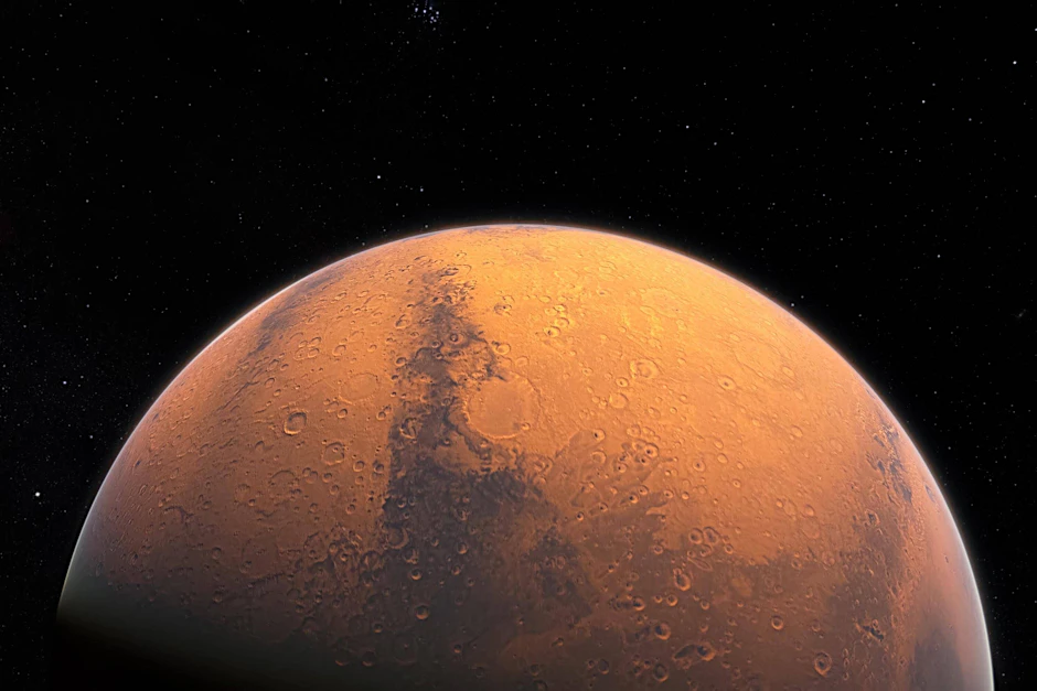 Der Planet Mars im Weltall. Ein Meteorit des Roten Planeten wird bald versteigert.