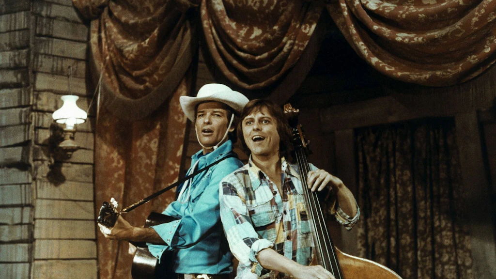 Dean Reed (li.) mit dem tschechischen Sänger Vaclav Neckar in der gefloppten Westernkomödie „Sing, Cowboy, sing“ von 1982.