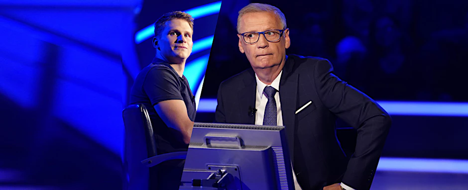 Erik Sparn-Wolf und Günther Jauch im Studio von Wer wird Millionär?. Weil sich der Quiz-Kandidat auf seinen Joker verlässt, rauscht er plötzlich ins Bodenlose.