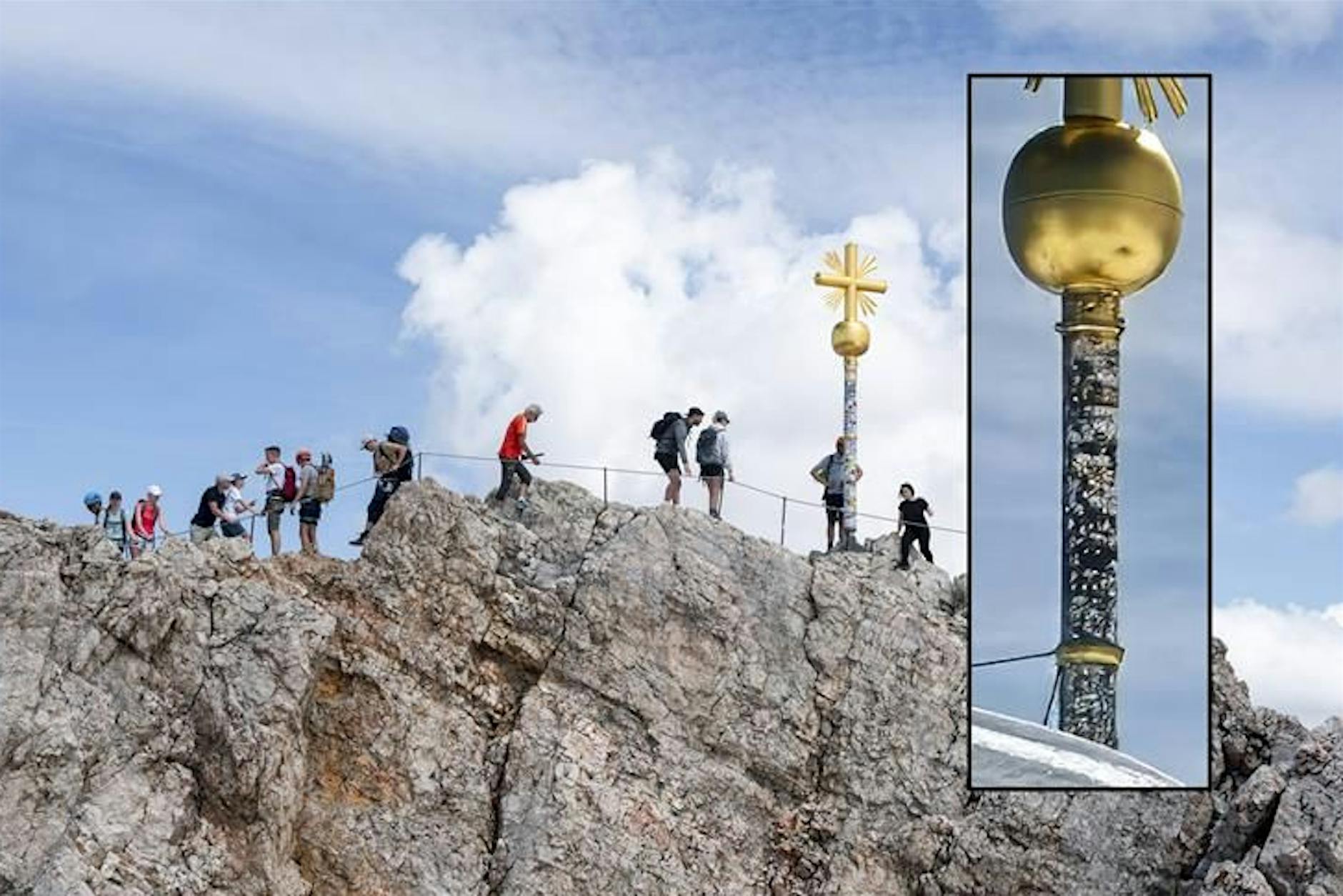 Sticker-Wahnsinn auf der Zugspitze – Gipfelkreuz muss in Reparatur