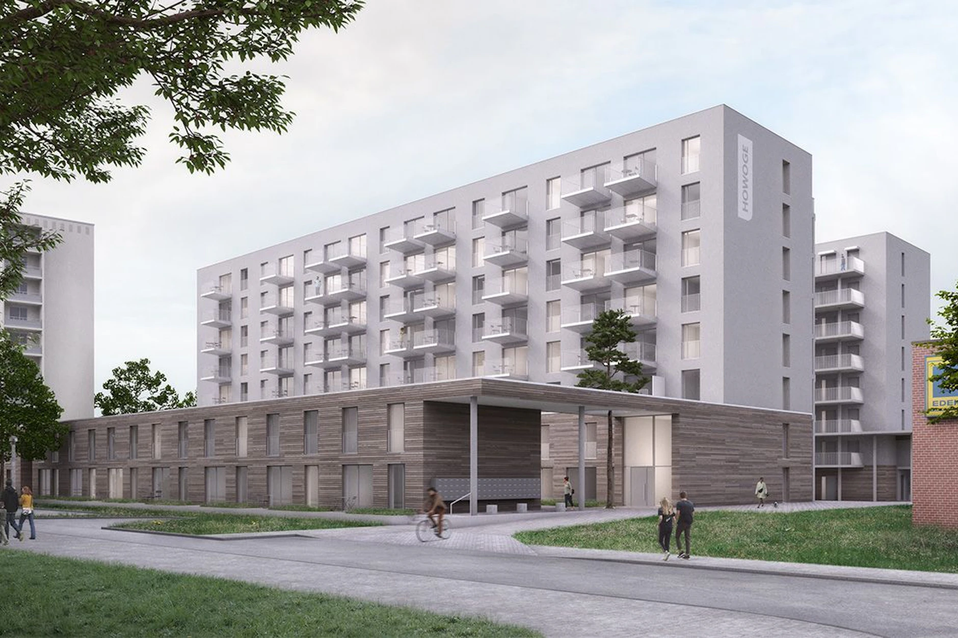 Auf dem Vordach wächst ein Baum. Am Rosenfelder Ring stehen zwei Wohnblocks mit 173 Wohnungen kurz vor der Fertigstellung. 