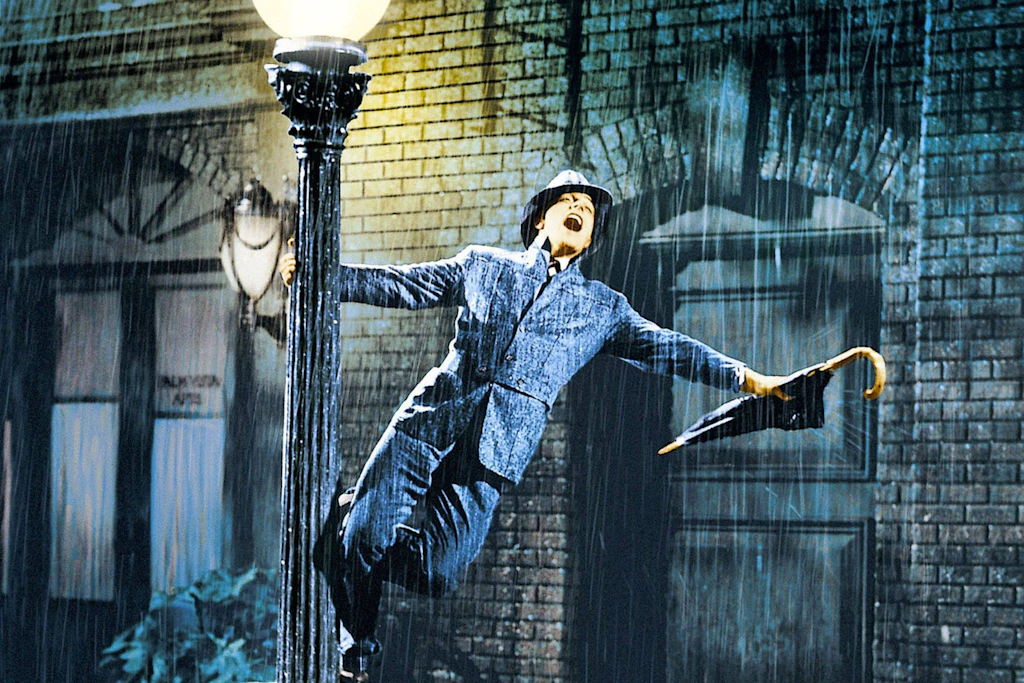 Regen? Kein Problem! In „Singin’ in the Rain“ von 1952 zeigt Gene Kelly, wie man auch bei Regen stilvoll und fröhlich tanzen kann.